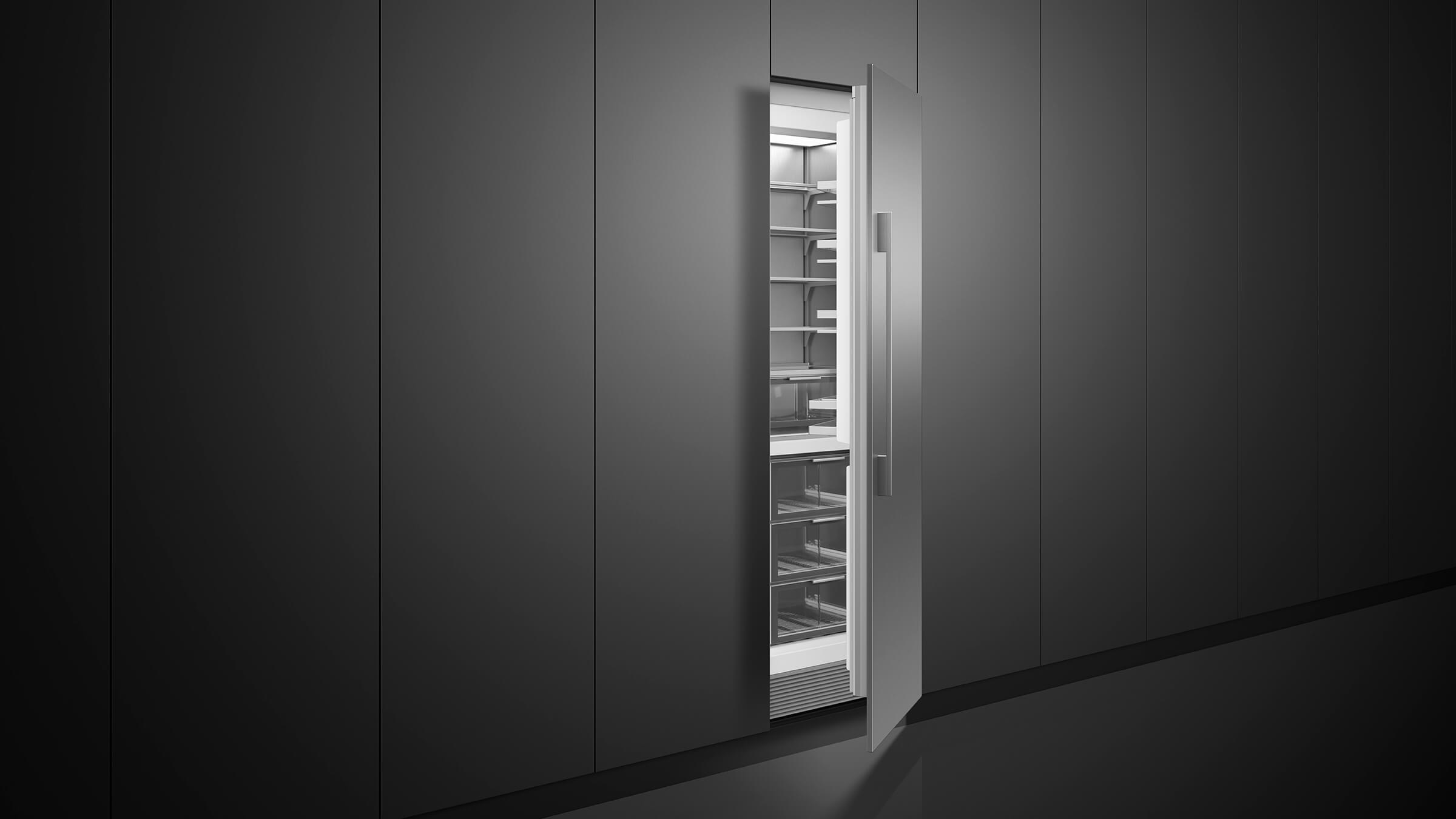 Modern kitchen featuring integrated vertical column refrigerator and freezer