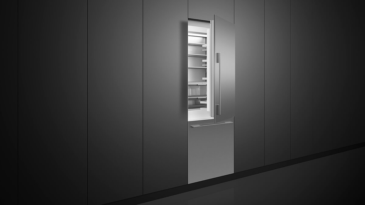 Built-in bottom freezer refrigerator with a stainless steel finish, aligned with modern kitchen cabinetry