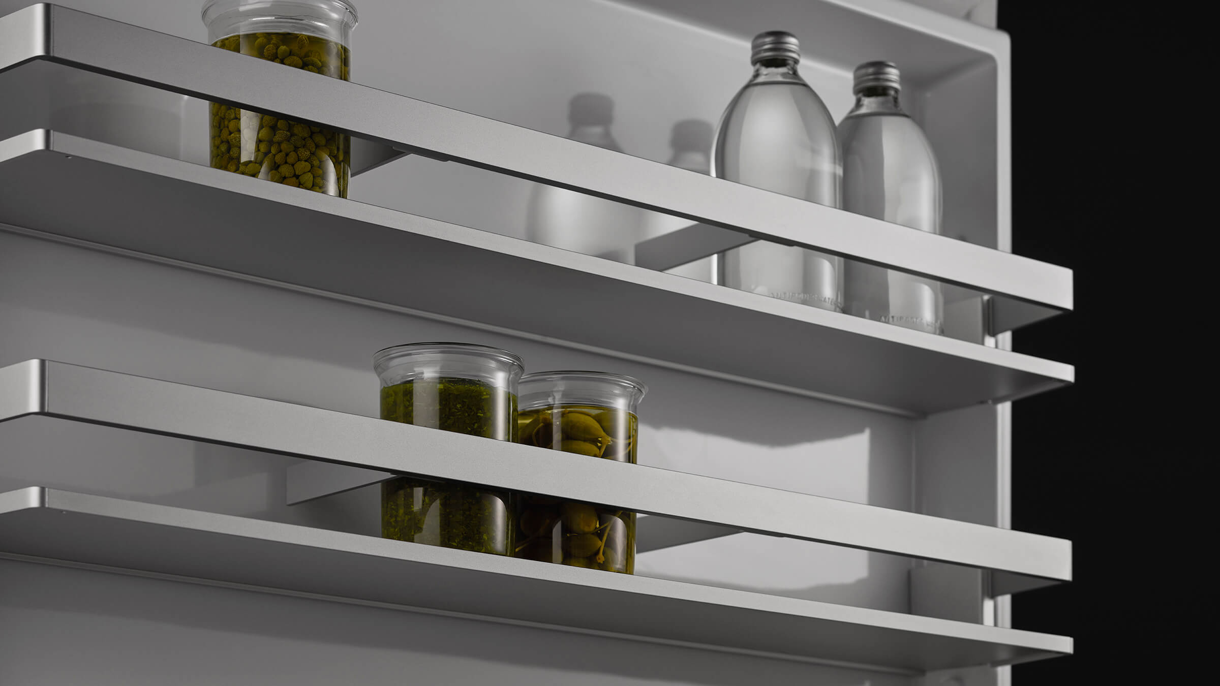 Detail view of the robust stainless steel hinges and interior of a vertical refrigerator