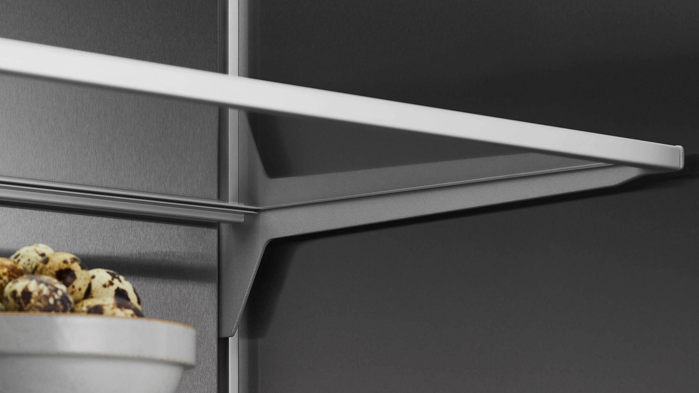 Configurable interior shelving for tall items in an integrated refrigerator